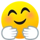 Smiling Face with Open Hands emoji, JoyPixels design